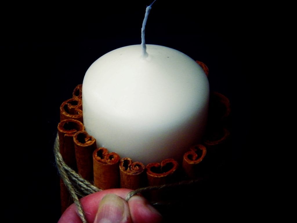tying cinnamon candle